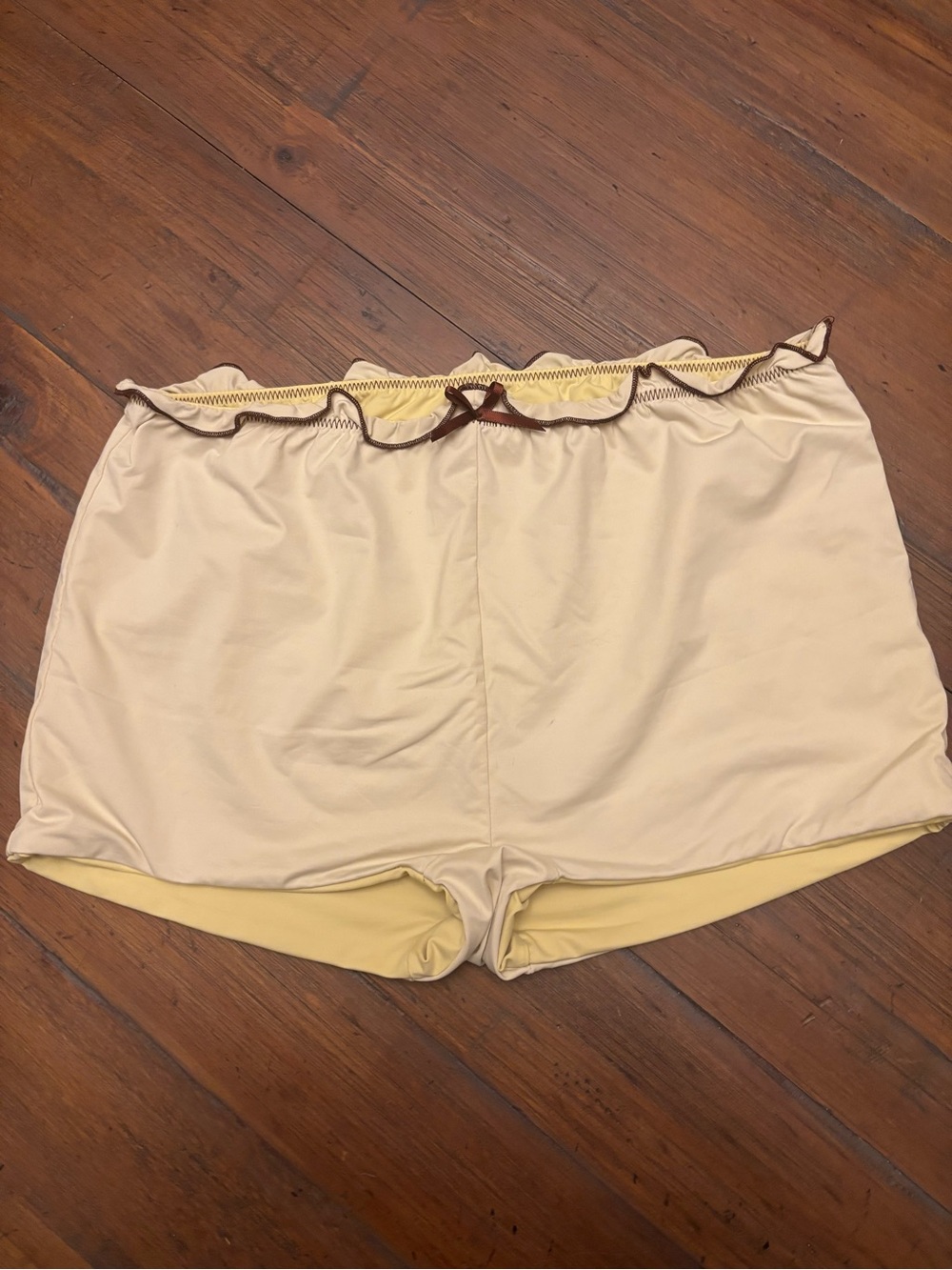 Frankie’s bikinis x Gigi HADID yellow swim shorts with brown trim